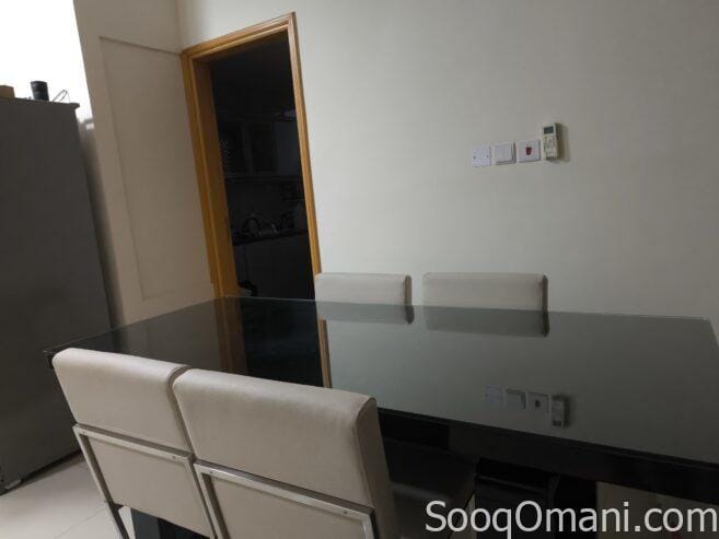 Dining table with glass top and 6 leather chairs