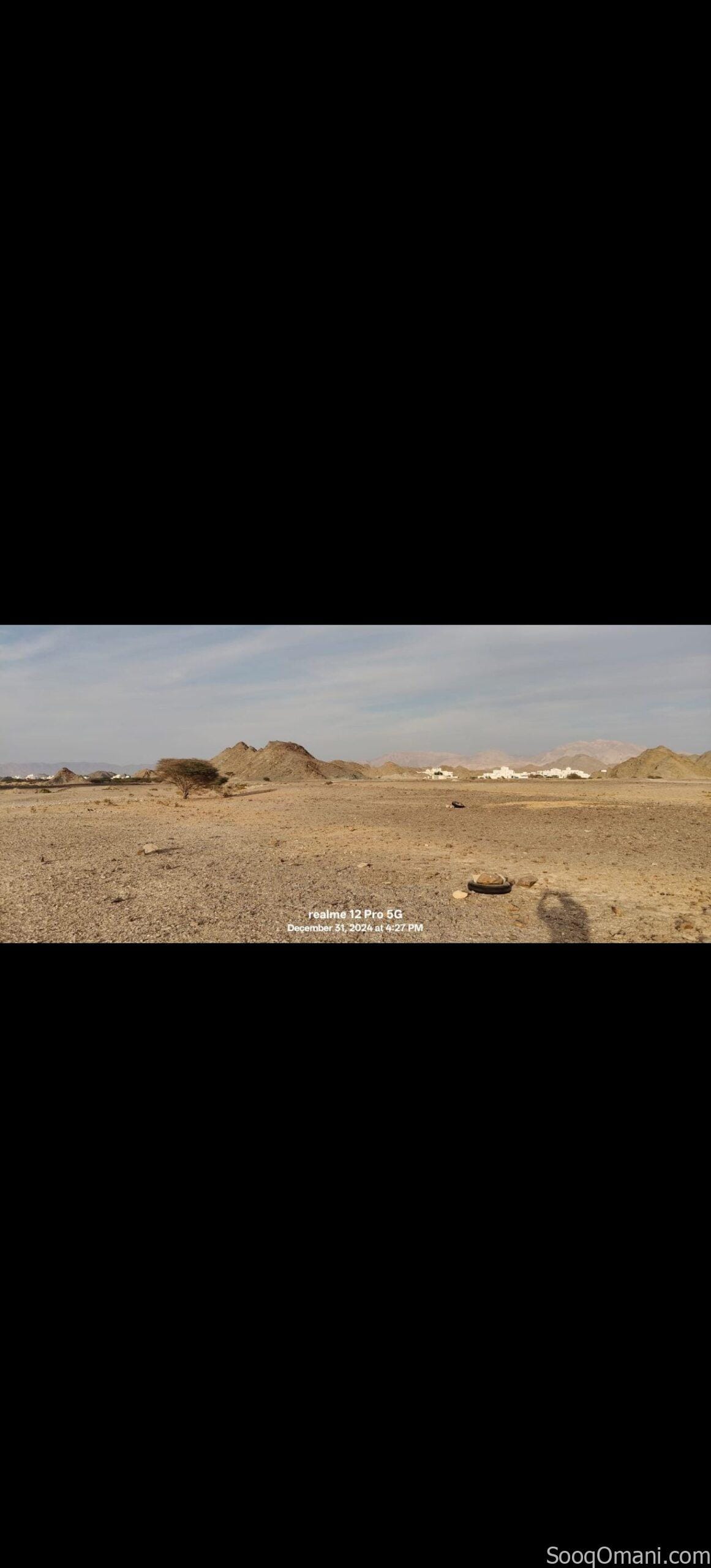 Residential commercial land for sale in Al Amarat, Al Nahda Extension 1; prime location.