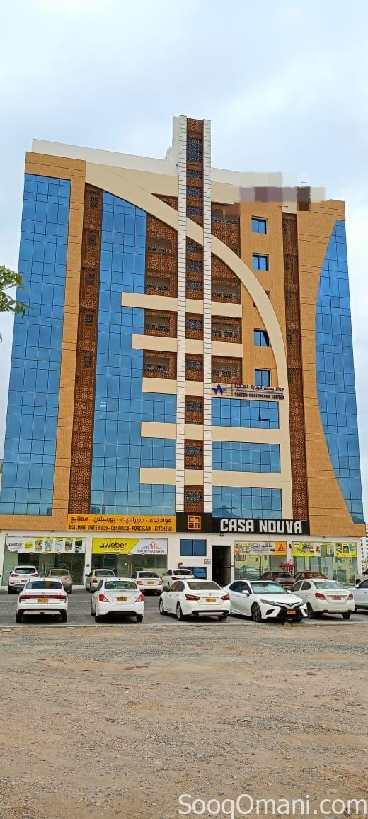For rent, a ground floor showroom in a new commercial residential building in Ghala, on the street