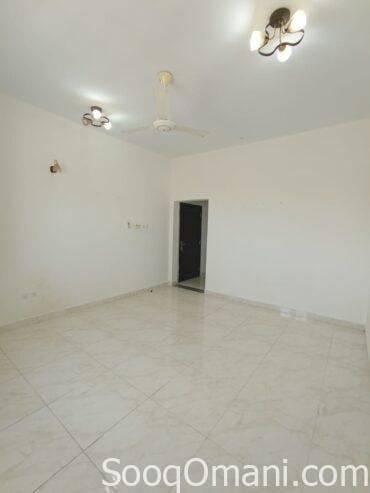 A spacious room designed as a lounge for families, located in Al Mawaleh 11.