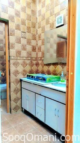 Room, bathroom and small kitchen in Al-Maabela