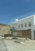 Two-story residential/commercial building for sale near the market in Qurha